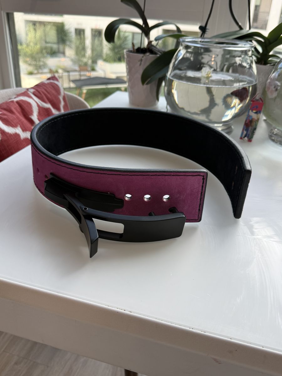 A brand new Leather lever lifting belt in burgundy with matte black lever buckle.